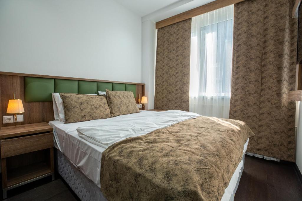 Postel nebo postele na pokoji v ubytování Hotel Cataleya