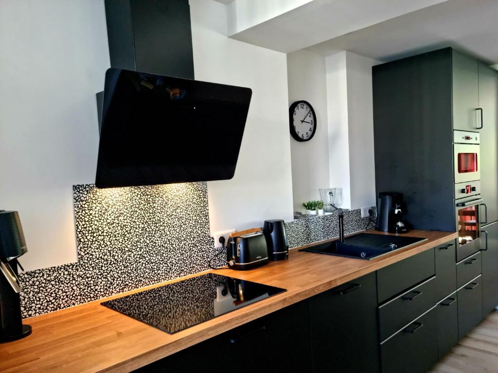 Kuchyňa alebo kuchynka v ubytovaní Appartement Cosy Caen