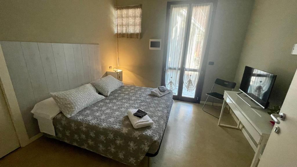 Postel nebo postele na pokoji v ubytování B&B Aurora