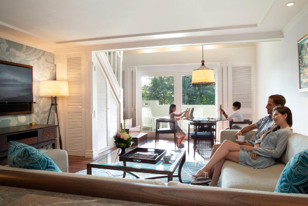 a group of people sitting in a living room at InterContinental Bali Resort by IHG in Jimbaran