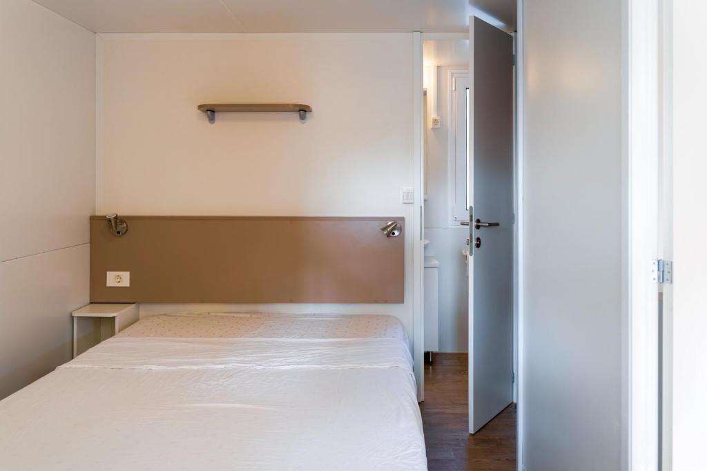 Postel nebo postele na pokoji v ubytování Camping Daino