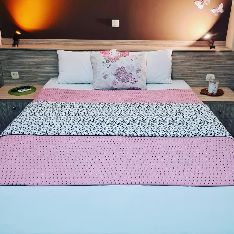 Postel nebo postele na pokoji v ubytování Hotel Bulevar