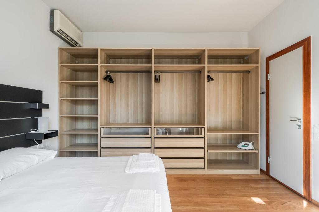Posteľ alebo postele v izbe v ubytovaní Tagliacozzi Suite Apartment