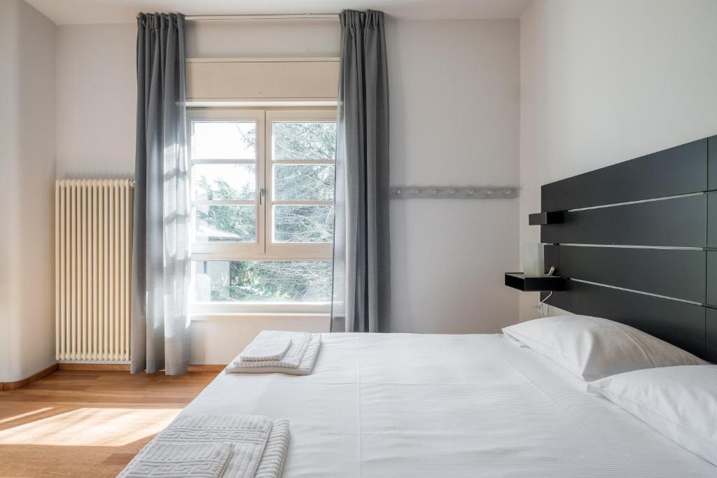 Posteľ alebo postele v izbe v ubytovaní Tagliacozzi Suite Apartment