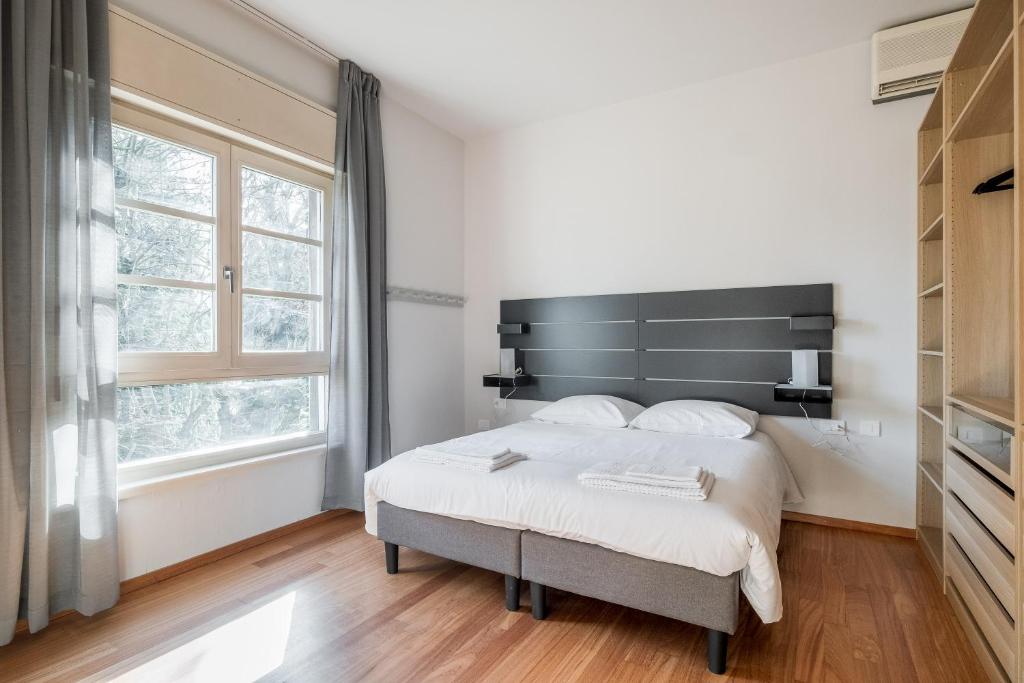 Posteľ alebo postele v izbe v ubytovaní Tagliacozzi Suite Apartment