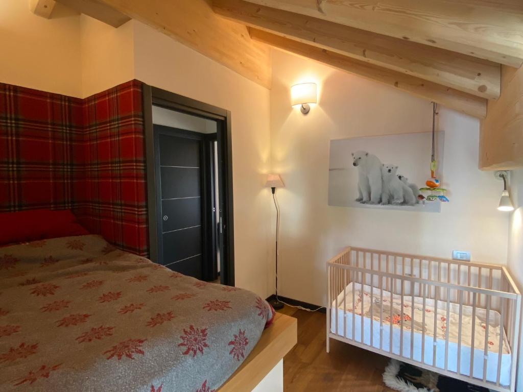 Postel nebo postele na pokoji v ubytování Chalet Ronchi - Foppolo Ski