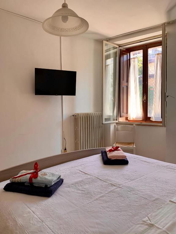 Postel nebo postele na pokoji v ubytování B&B Nonno Loreto