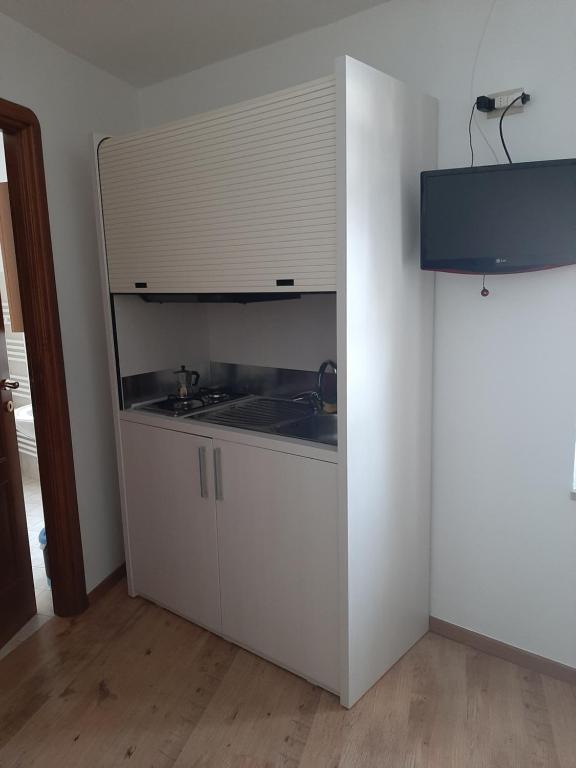 a kitchen with a sink and a counter at Alloggi Il Rododendro in Bagni di Vinadio