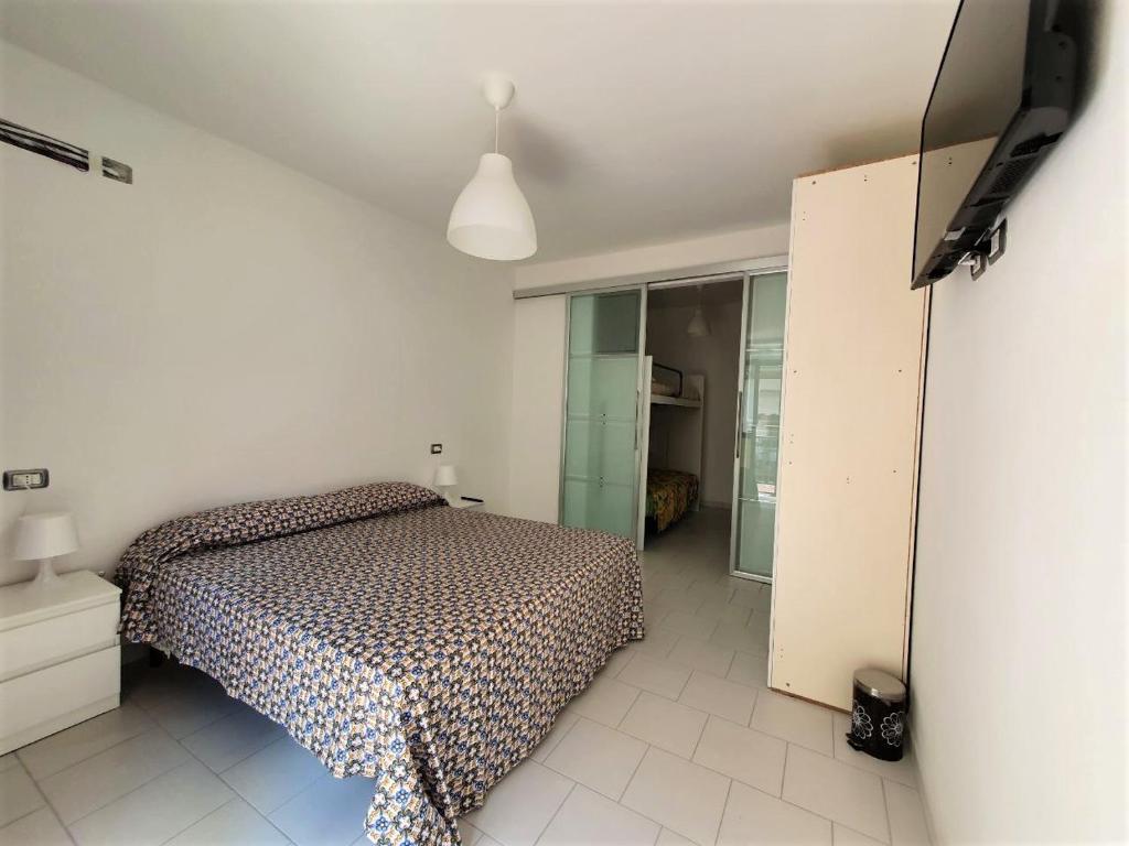 Łóżko lub łóżka w pokoju w obiekcie Affittacamere Casa Cynda