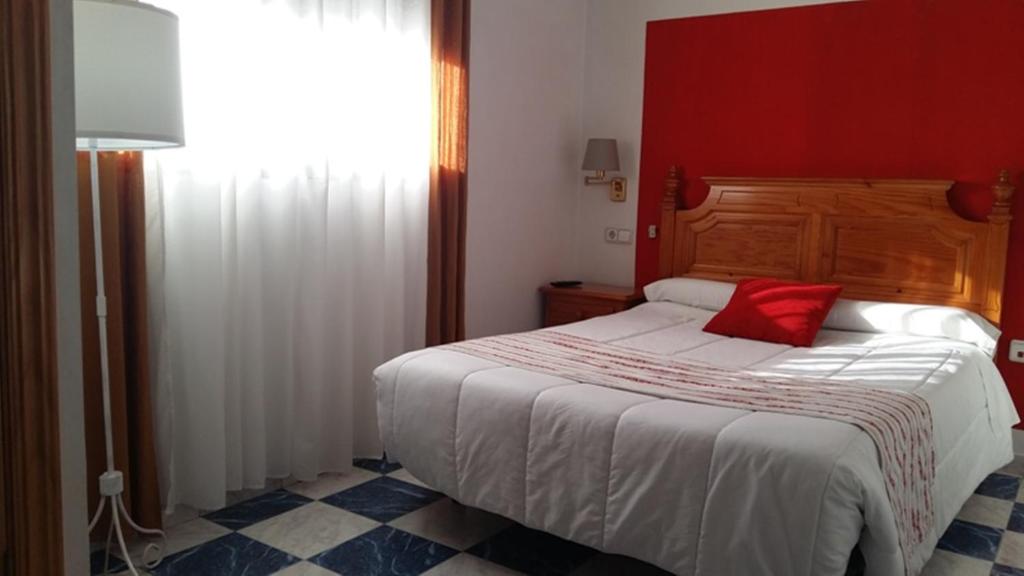 Postel nebo postele na pokoji v ubytování Hotel Corona de Atarfe