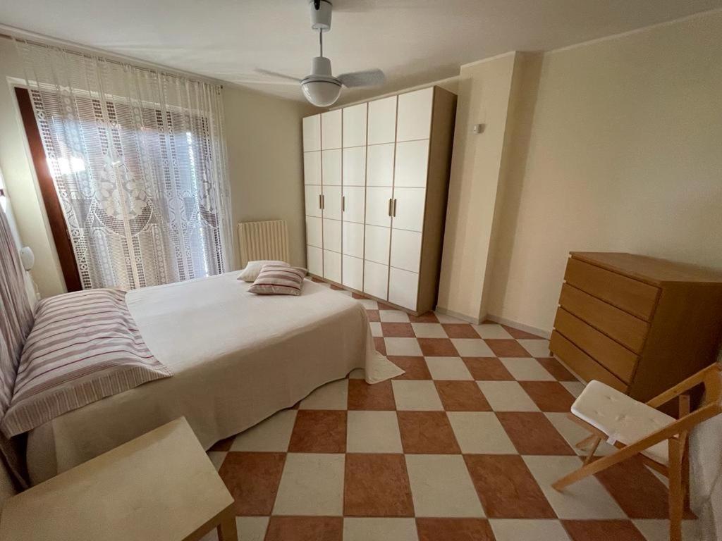 Posteľ alebo postele v izbe v ubytovaní Appartamento Mimosa