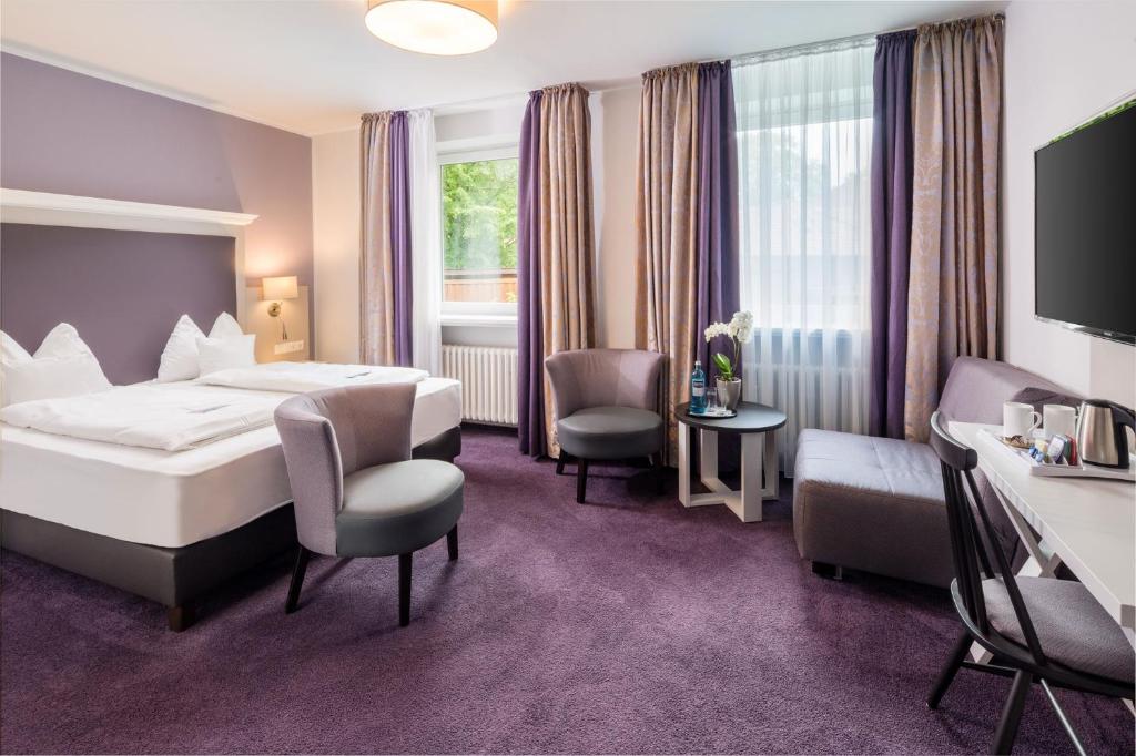 Postel nebo postele na pokoji v ubytování Flair Hotel Rieckmann