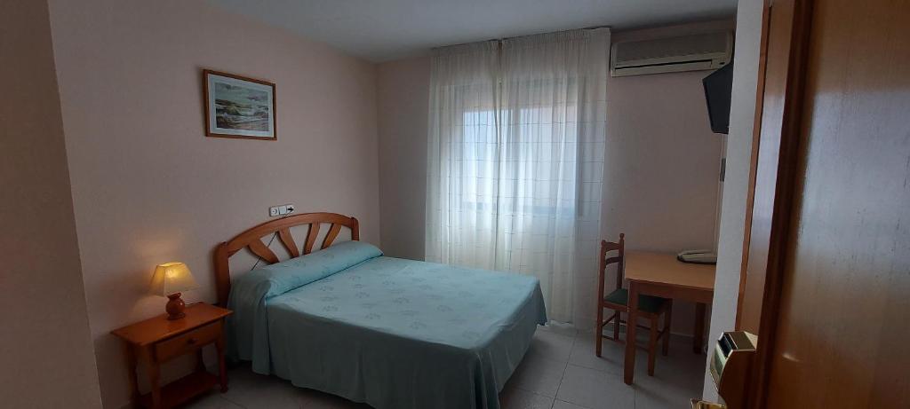 Postel nebo postele na pokoji v ubytování LOS NAREJOS Hotel