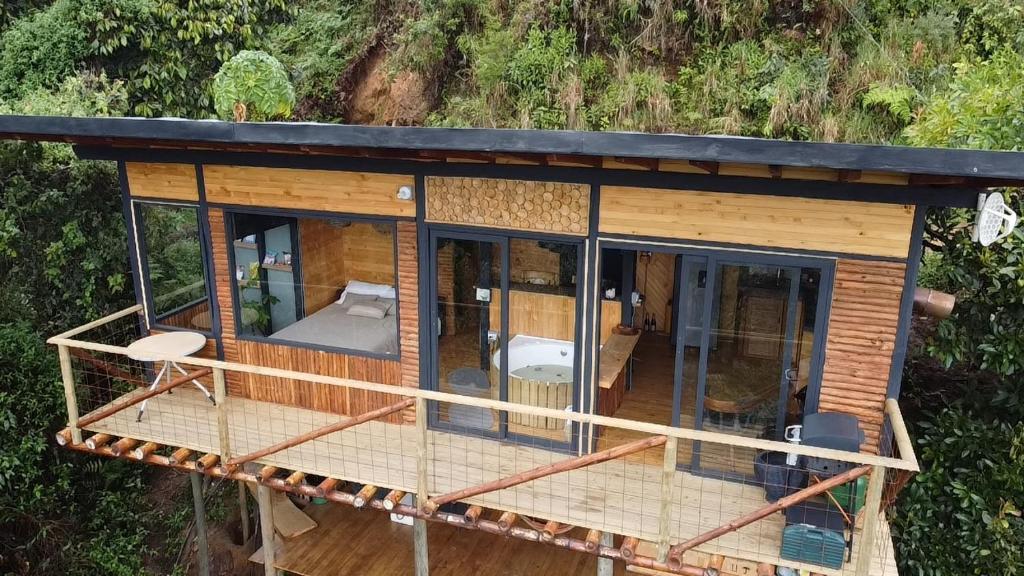 an overhead view of a tiny house with glass at Glamping con jacuzzi cerca a Medellin in Guarne
