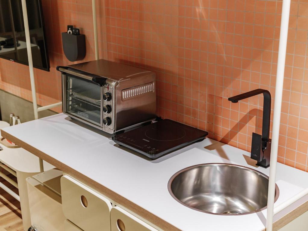 Kuchyň nebo kuchyňský kout v ubytování The Somos Flats Provenza