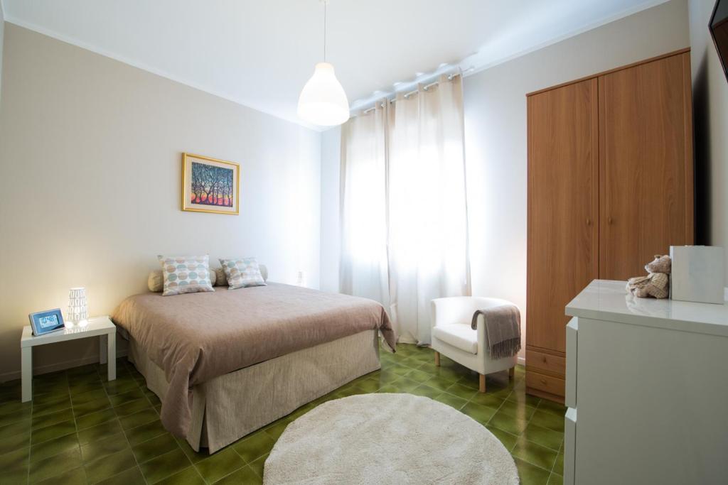 מיטה או מיטות בחדר ב-La Casa di Merion