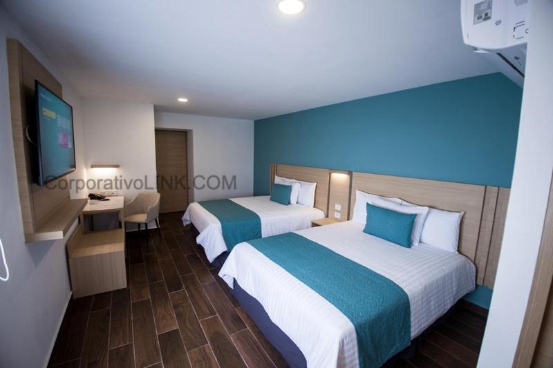 Postel nebo postele na pokoji v ubytování Hotel Plaza Sol Veracruz