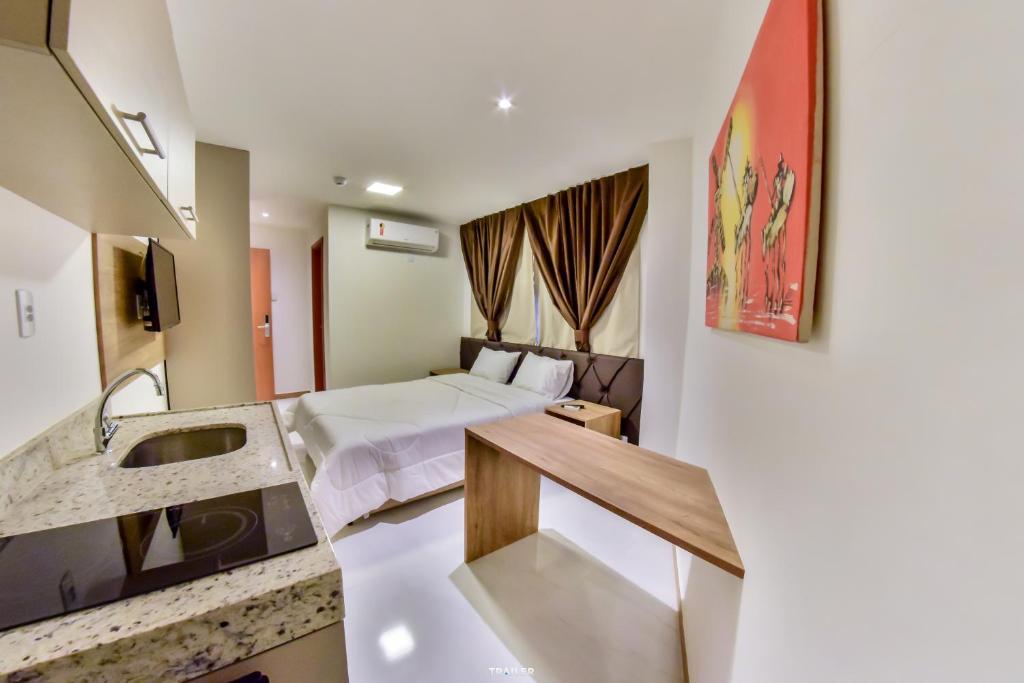 Kuchyň nebo kuchyňský kout v ubytování Hotel Aracaju Suites