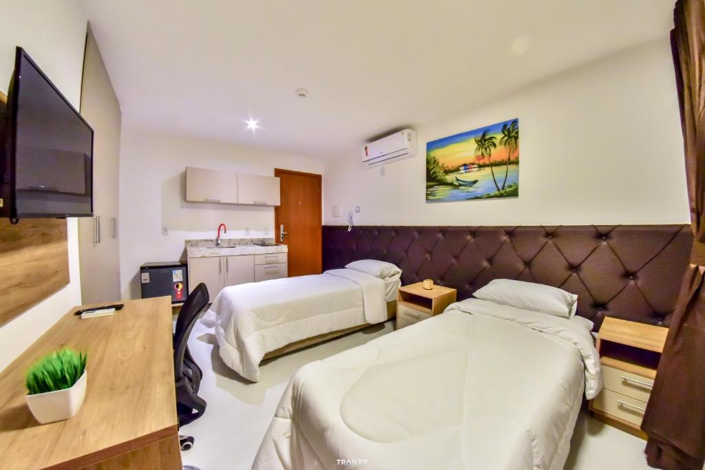 TV a/nebo společenská místnost v ubytování Hotel Aracaju Suites