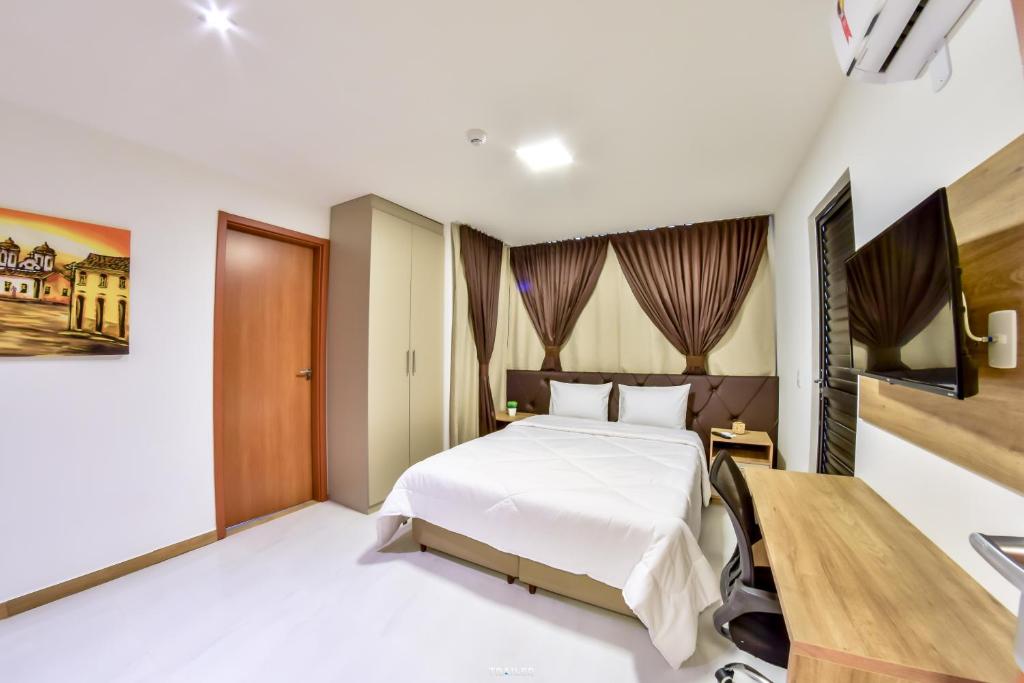 Postel nebo postele na pokoji v ubytování Hotel Aracaju Suites