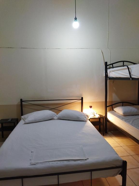 Postel nebo postele na pokoji v ubytování SAN REMO HOSTEL