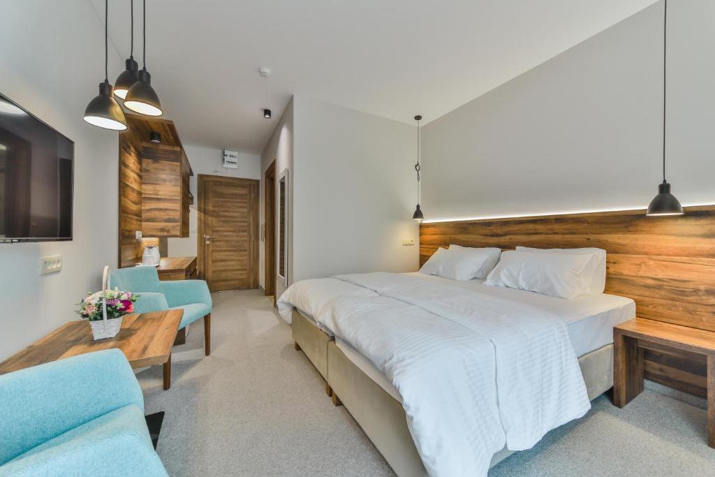 Postel nebo postele na pokoji v ubytování Hotel Vladimir