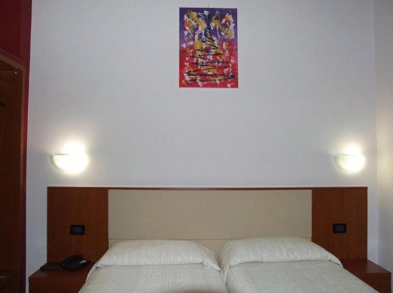 Postel nebo postele na pokoji v ubytování Eco Art Hotel Statuto