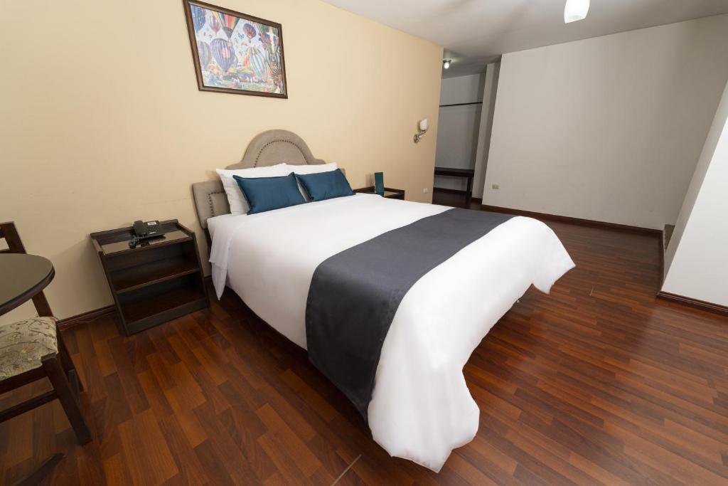 Postel nebo postele na pokoji v ubytování Hotel Boutique Selva Alegre