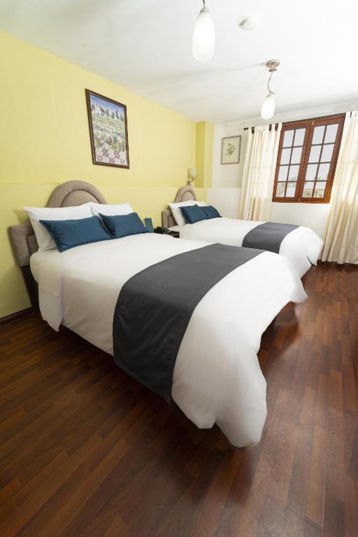 Postel nebo postele na pokoji v ubytování Hotel Boutique Selva Alegre