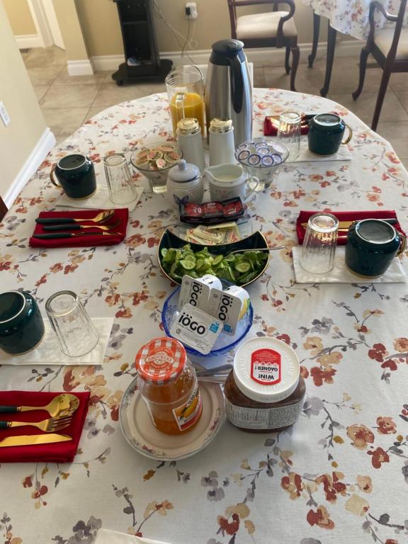 a table with food and drinks on top of it at Butterfly Manor in Niagara Falls