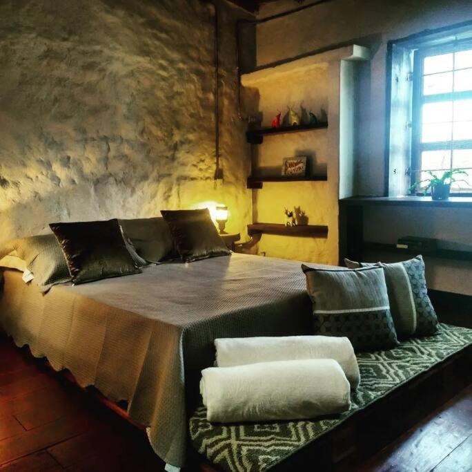 a bedroom with a large bed with two pillows on it at Apartamento la 15 in Pereira