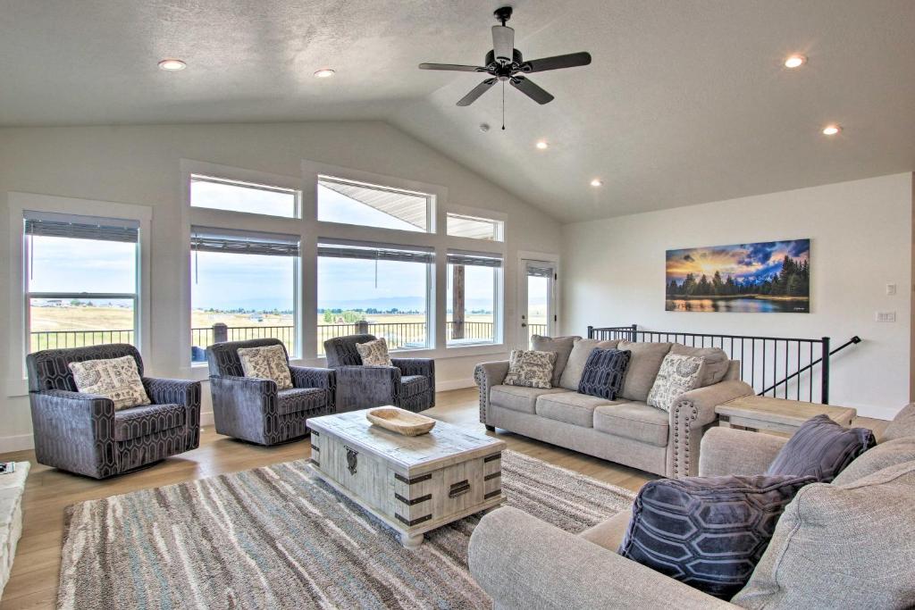 a living room with couches and chairs and a ceiling fan at Garden City Retreat with Access to Bear Lake! in Garden City