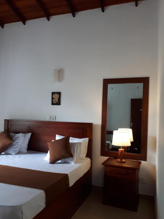 Postel nebo postele na pokoji v ubytování Jal,Min Homestay