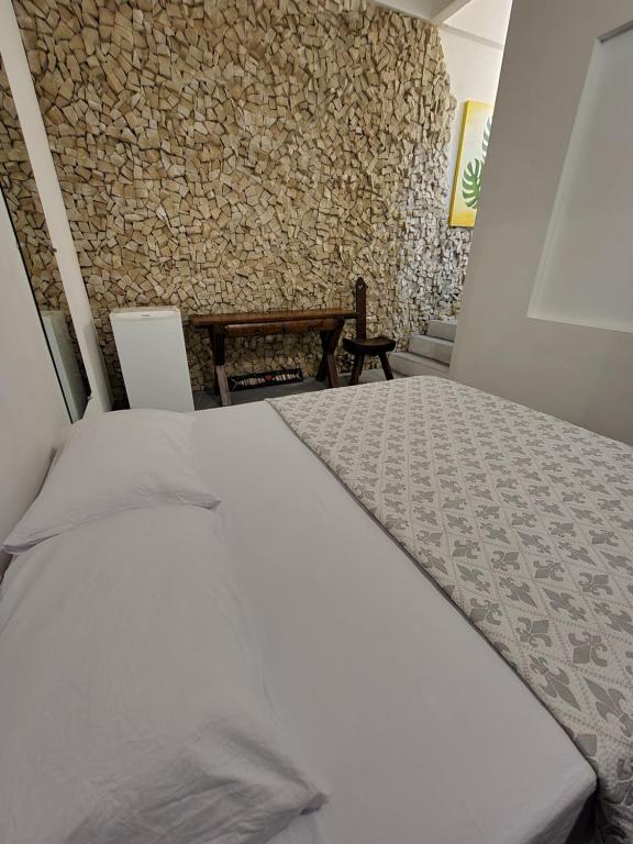 Postel nebo postele na pokoji v ubytování Buddha Suítes
