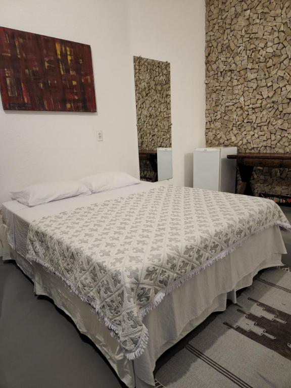 Postel nebo postele na pokoji v ubytování Buddha Suítes