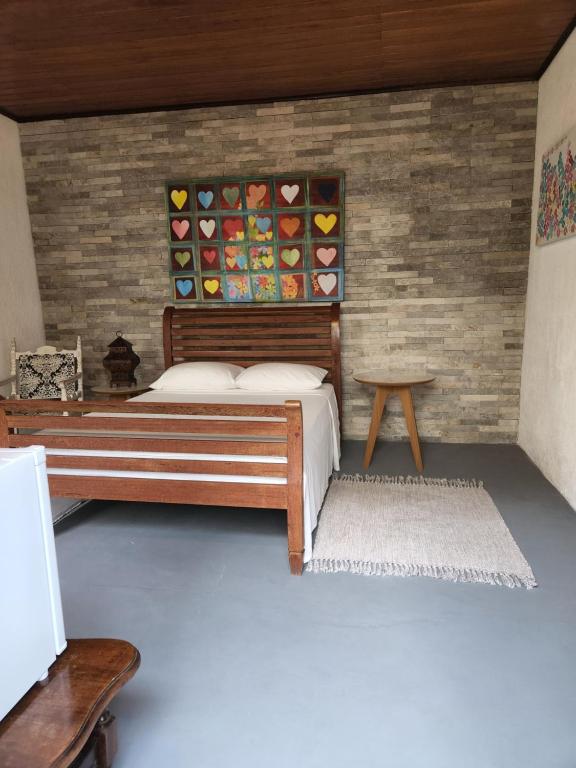 Postel nebo postele na pokoji v ubytování Buddha Suítes