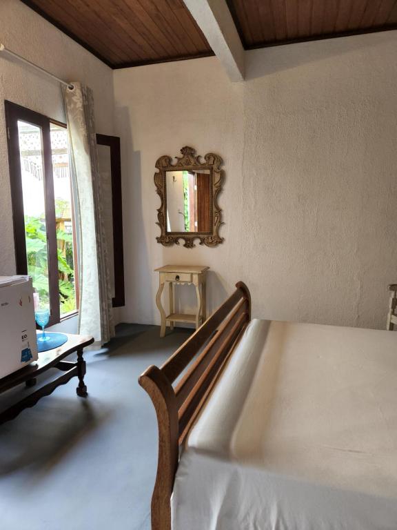 Postel nebo postele na pokoji v ubytování Buddha Suítes
