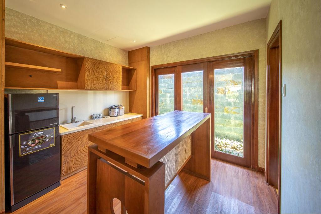 Kuchyň nebo kuchyňský kout v ubytování Sao Mai Beach Resort