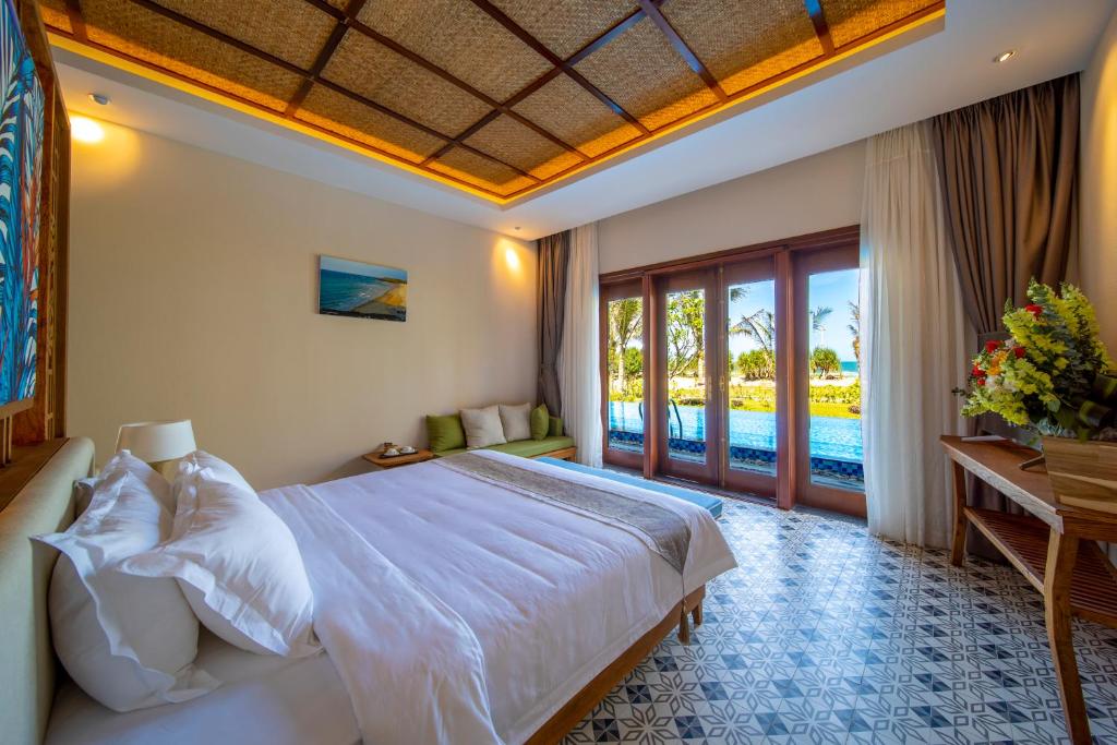 Postel nebo postele na pokoji v ubytování Sao Mai Beach Resort