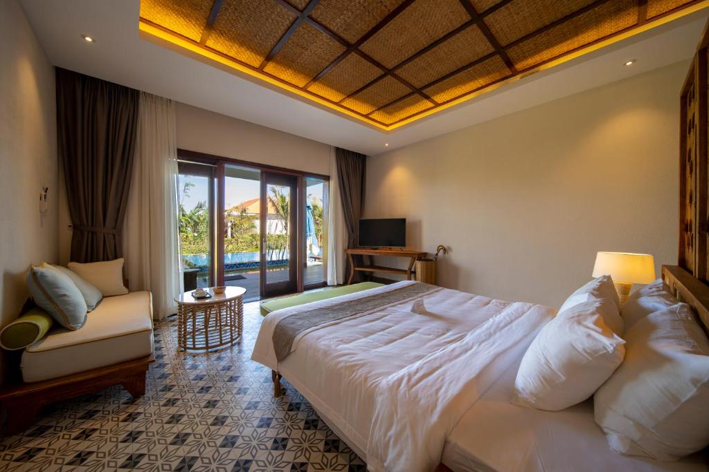Postel nebo postele na pokoji v ubytování Sao Mai Beach Resort