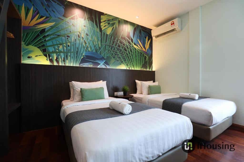 Postel nebo postele na pokoji v ubytování Trevor Hotel Malacca Town By I Housing