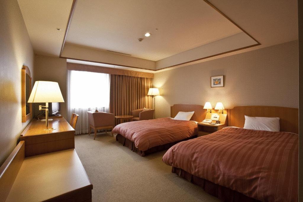 Postel nebo postele na pokoji v ubytování Hotel Mielparque Nagoya