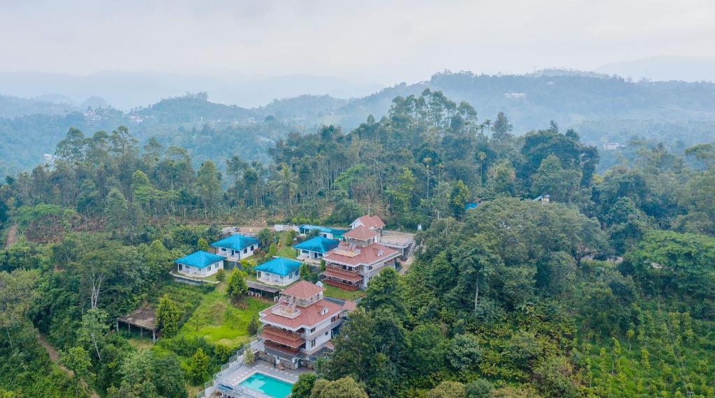 an aerial view of a house in the forest at Zenha Resorts in Munnar
