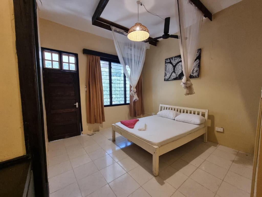 Postel nebo postele na pokoji v ubytování Tulia House Backpackers