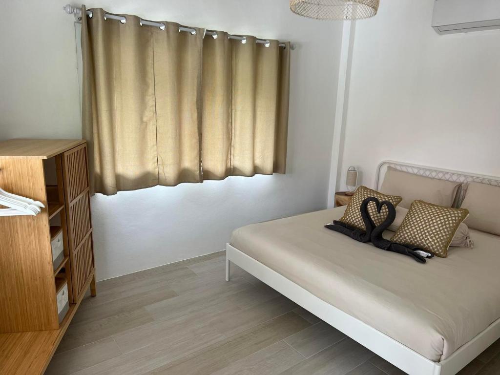 Postel nebo postele na pokoji v ubytování Sunset Lover Beach Residence
