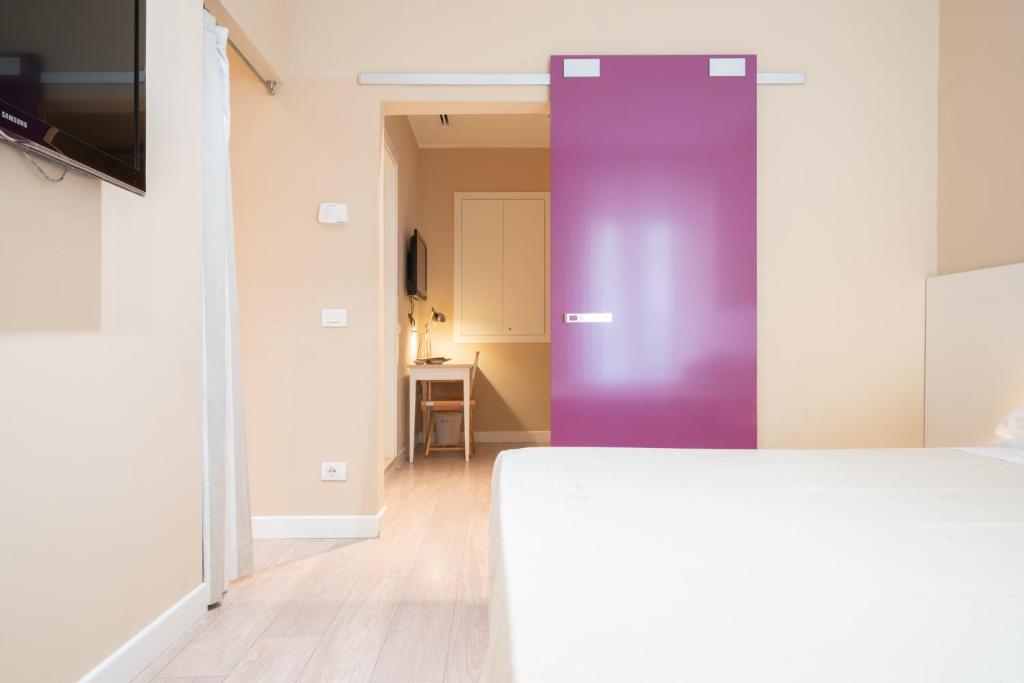 Postel nebo postele na pokoji v ubytování Hotel Bristol