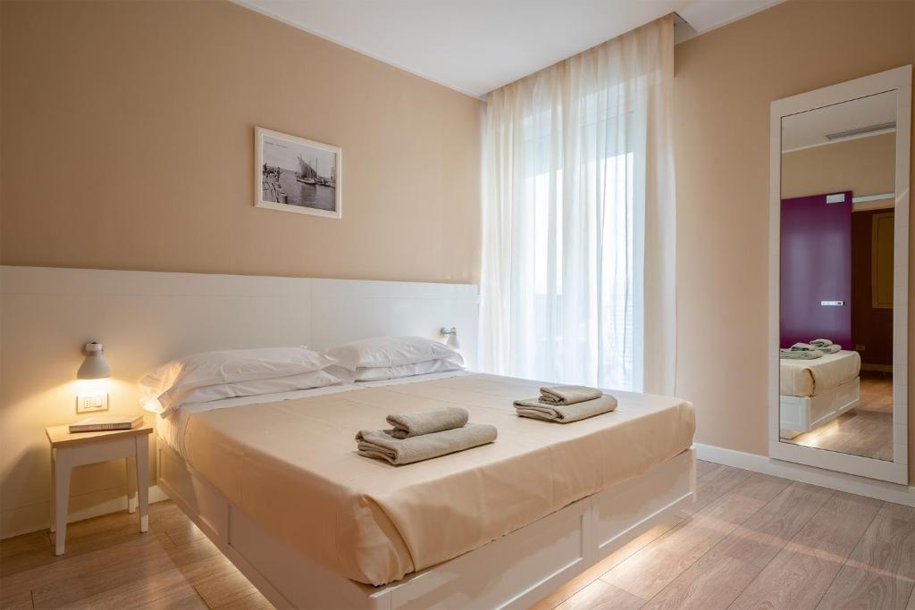 Postel nebo postele na pokoji v ubytování Hotel Bristol
