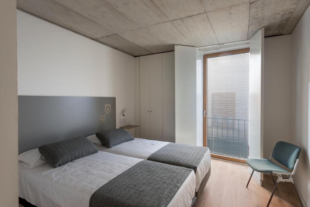 Cama o camas de una habitación en Hotel SempreFisterra