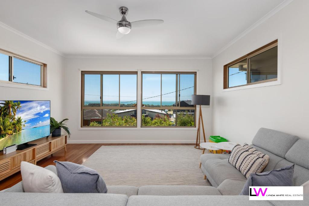 a living room with a couch and a tv at Picturesque Portarlington in Portarlington