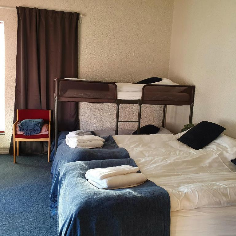Postel nebo postele na pokoji v ubytování The Bank Sleeping Guesthouse